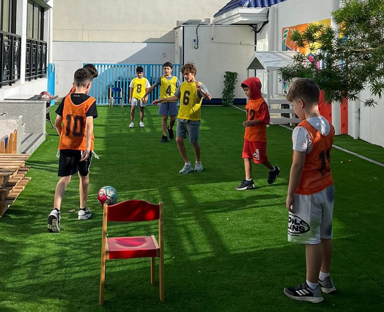 Children playing organized games on artificial turf